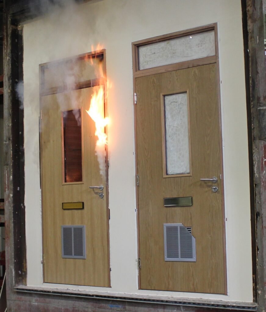 Fire door with damaged leaf edge and gap at the frame